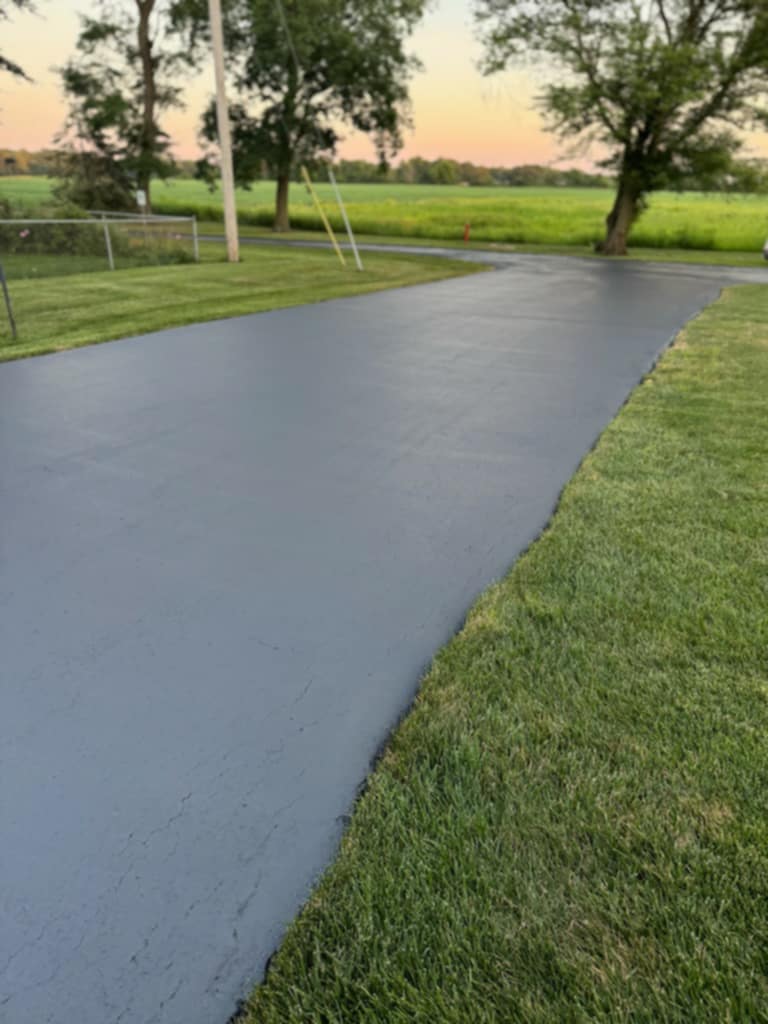 Beautifully sealed curved driveway with professional finish